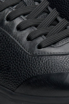 Men's soft leather sneakers in black by Estro - close-up on the lacing system.