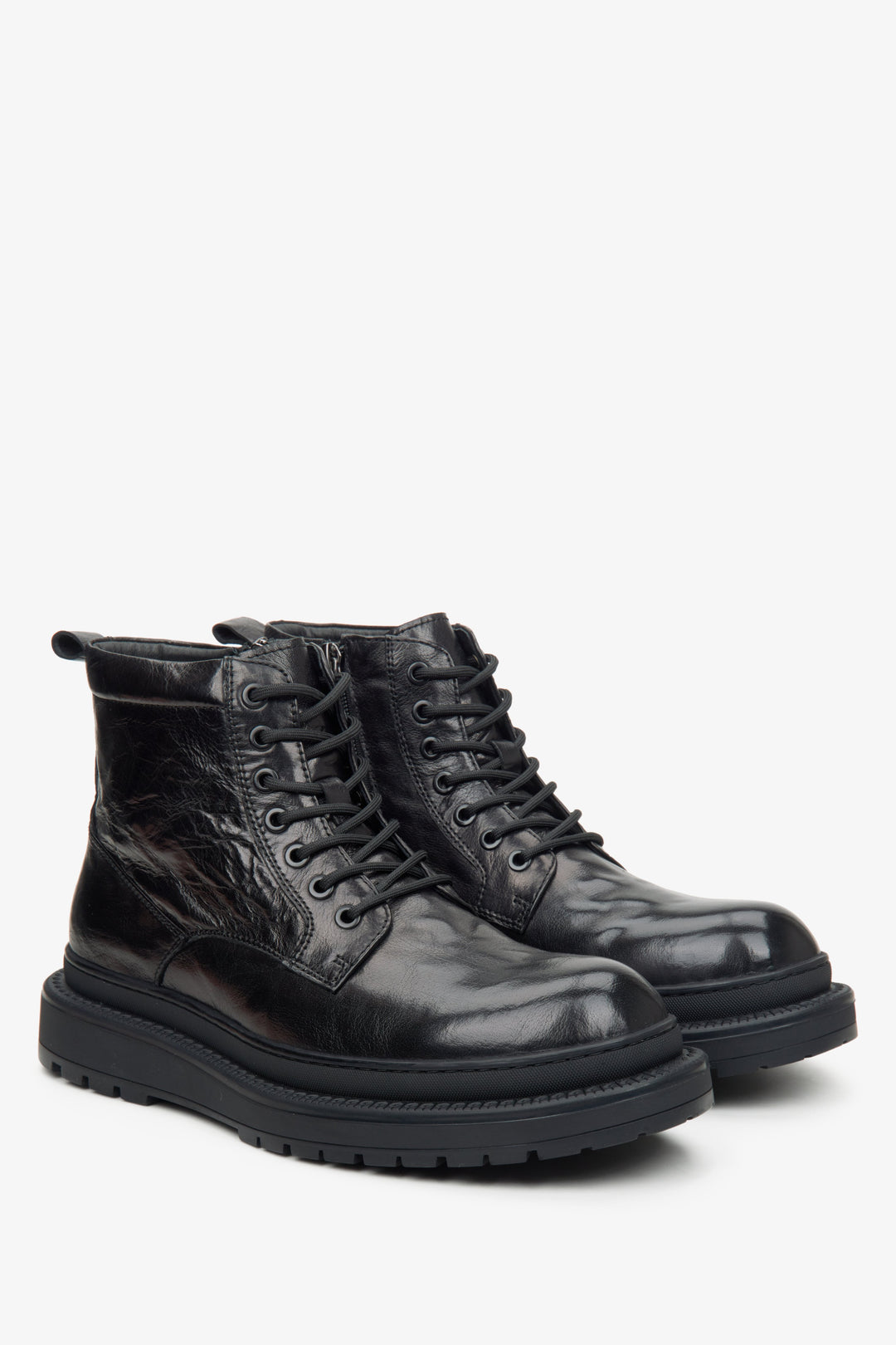 Men's black boots with insulation made of glossy genuine leather by Estro.