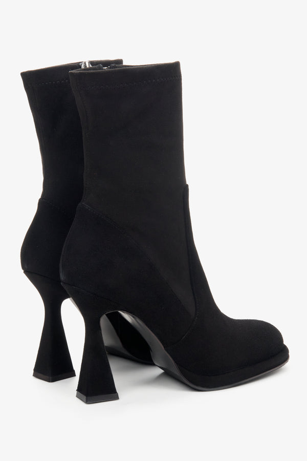 Women's black ankle boots with funnel heel made of genuine velour by Estro - close-up on the side line and heel.