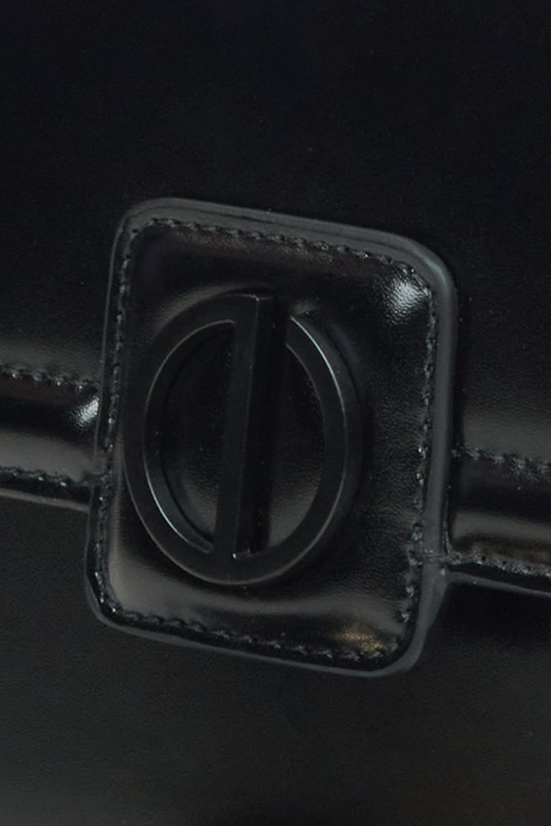 Small black leather handbag by Estro - close-up of the detail.