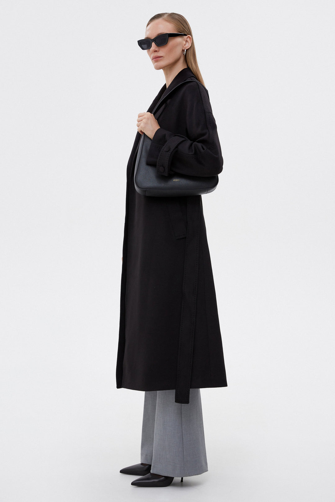 Classic women's black coat with a belt by Estro.