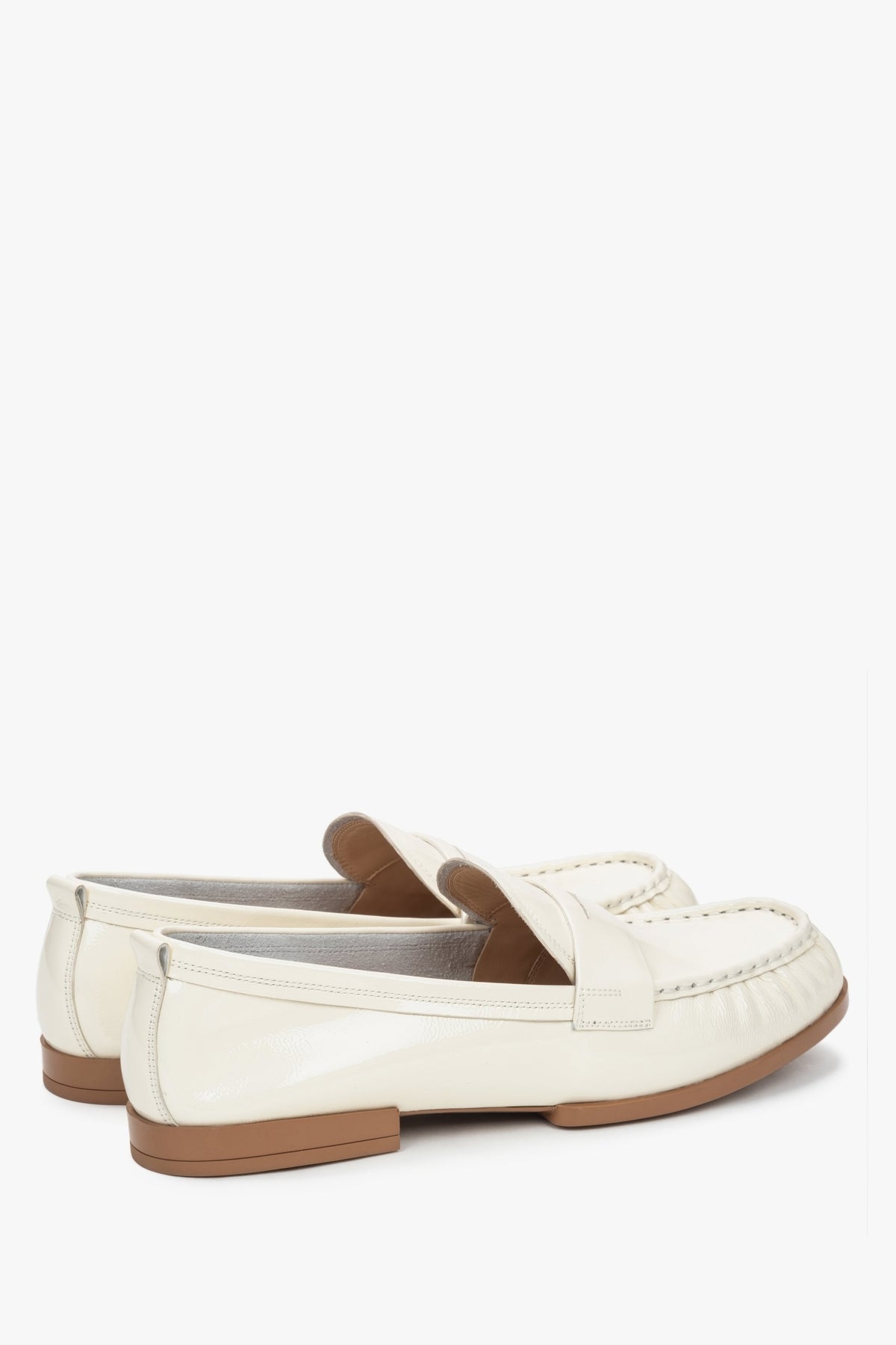 Patent leather women's loafers by Estro in a shade of white.