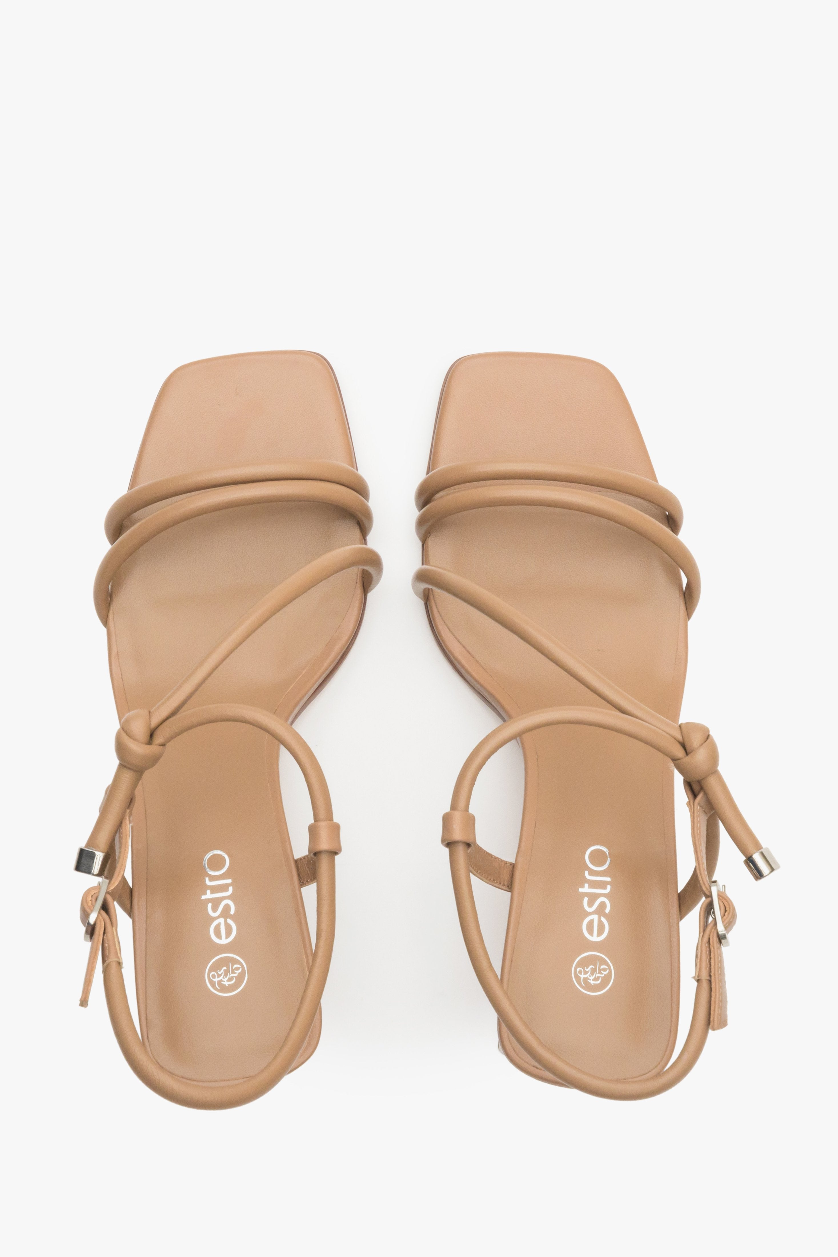 Women's strappy sandals in light brown on a block heel - presentation of the footwear from above.