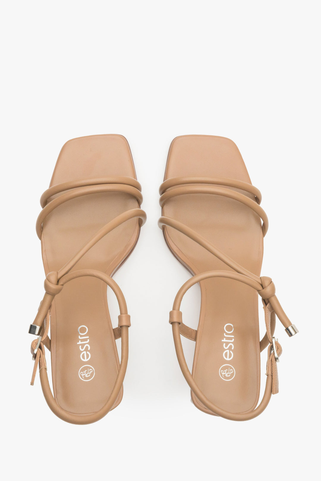 Women's strappy sandals in light brown on a block heel - presentation of the footwear from above.