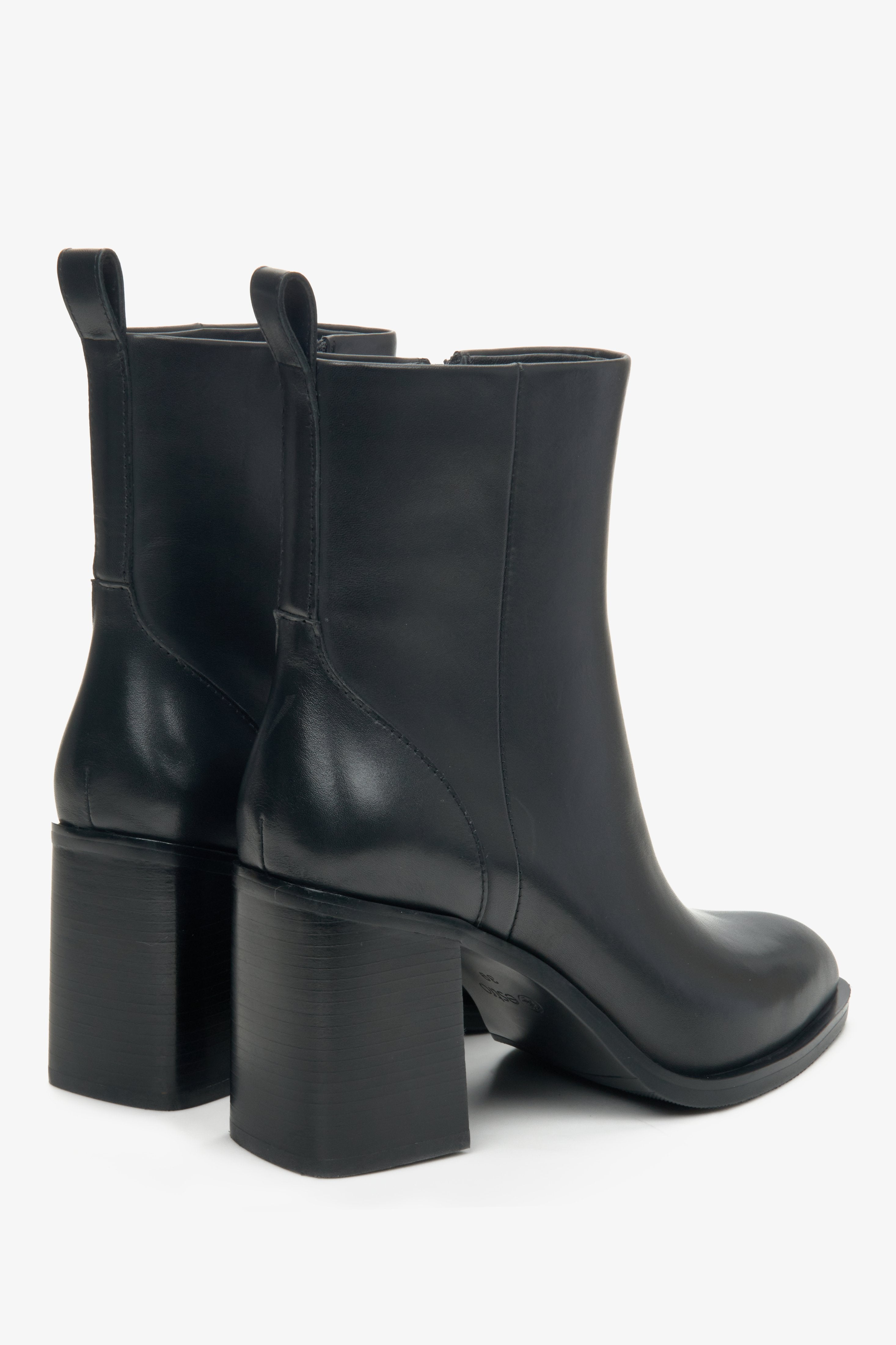 Women's black leather ankle boots with a stiletto heel by Estro - close-up on the heel.