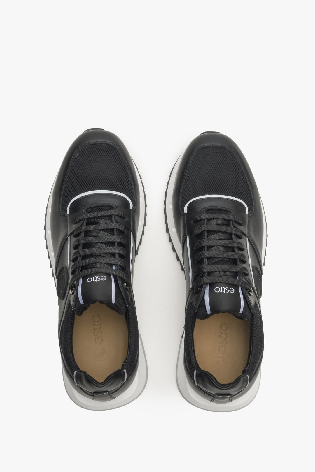 Men's black sneakers made of leather and textiles - top view presentation of the footwear.