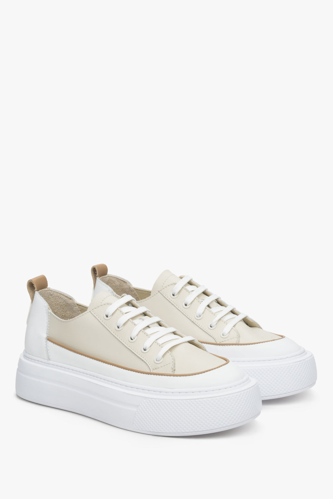 Women's low top sneakers made of natural leather in beige and white.
