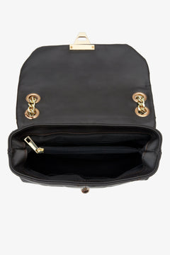 Dark brown Estro women's handbag with quilting made from natural leather and a gold chain - interior model presentation.
