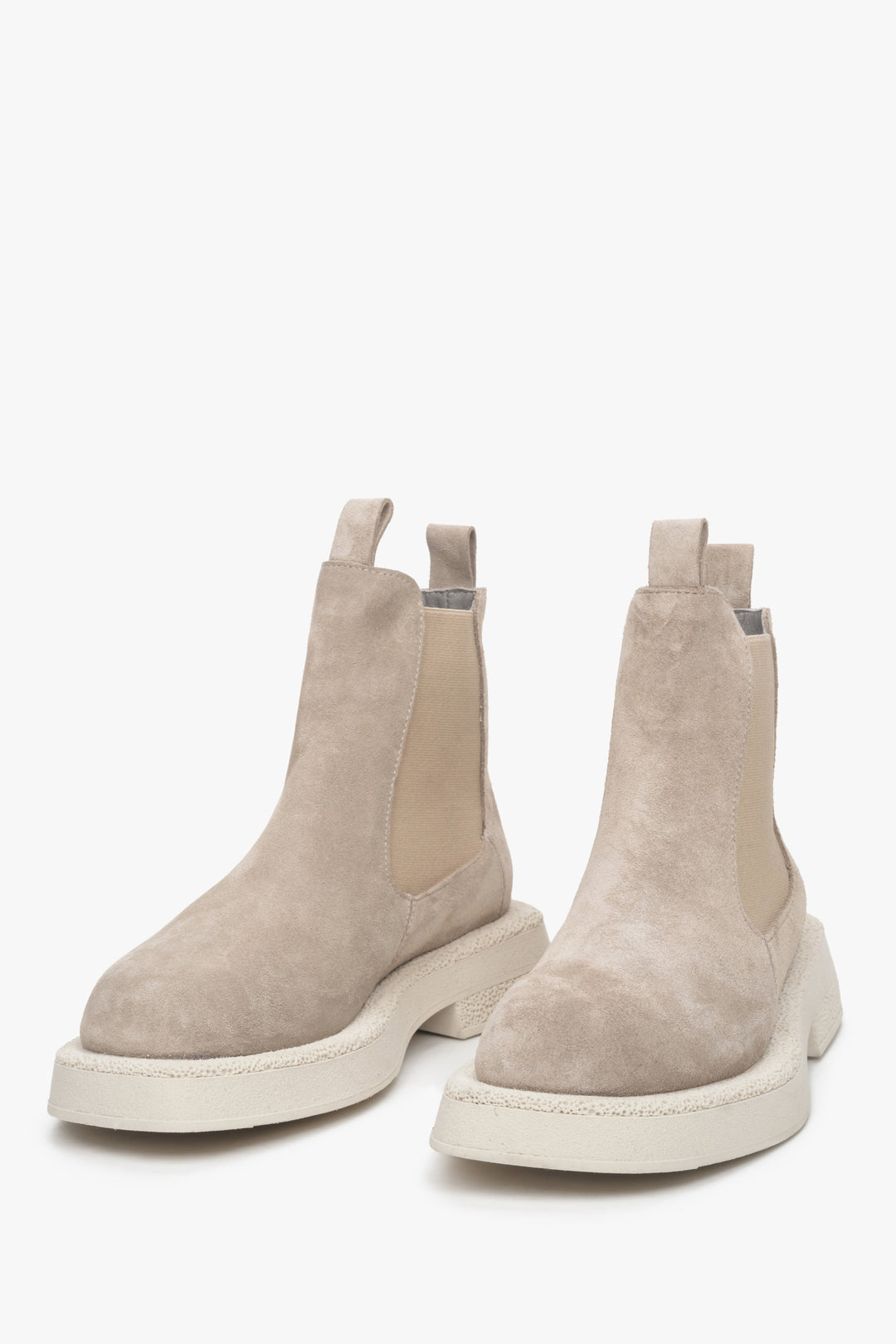 Women's beige Chelsea boots made of genuine suede - a close-up on tip of the shoe.