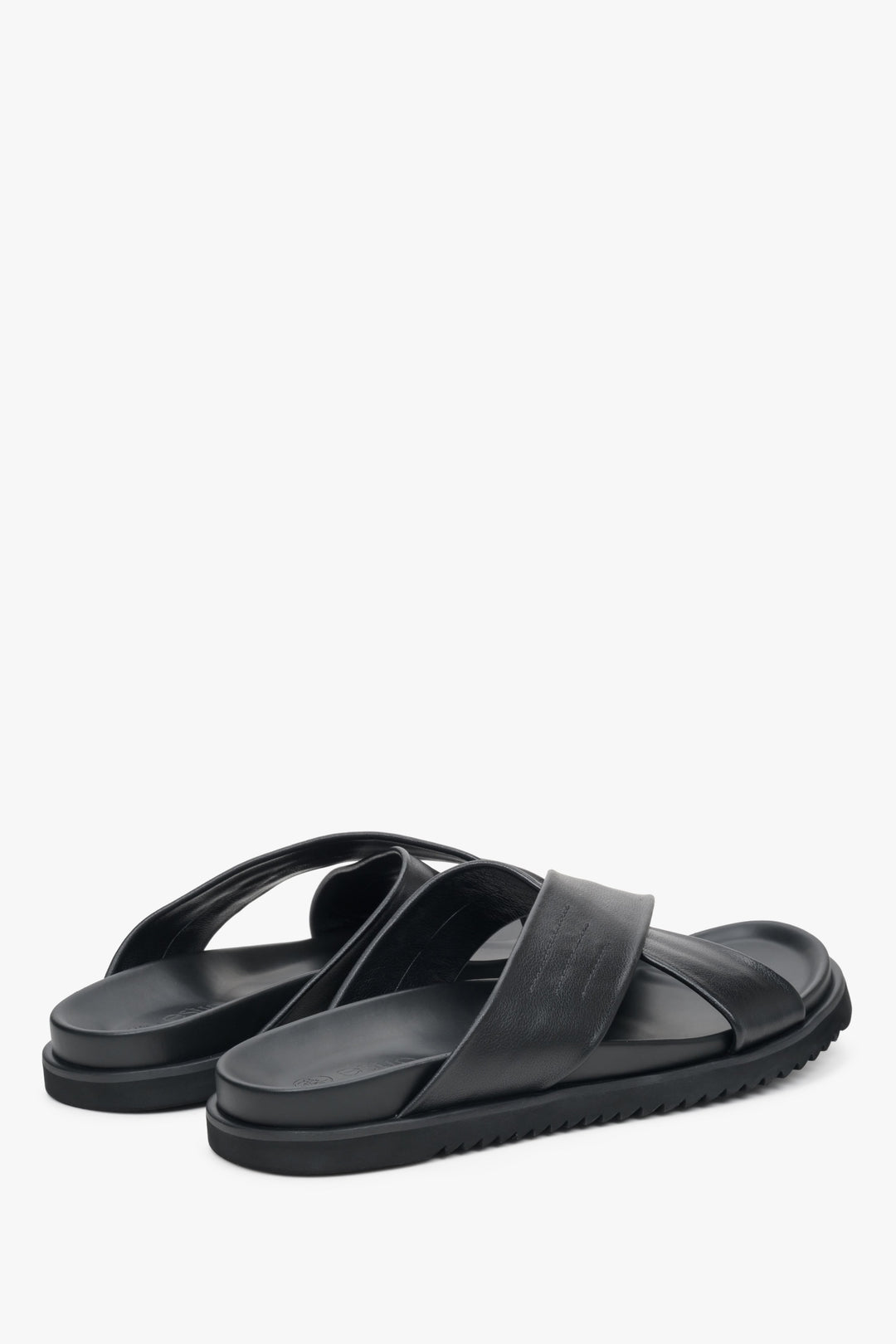 Men's black leather sandals with thick cross straps - close-up on the side line and heel.