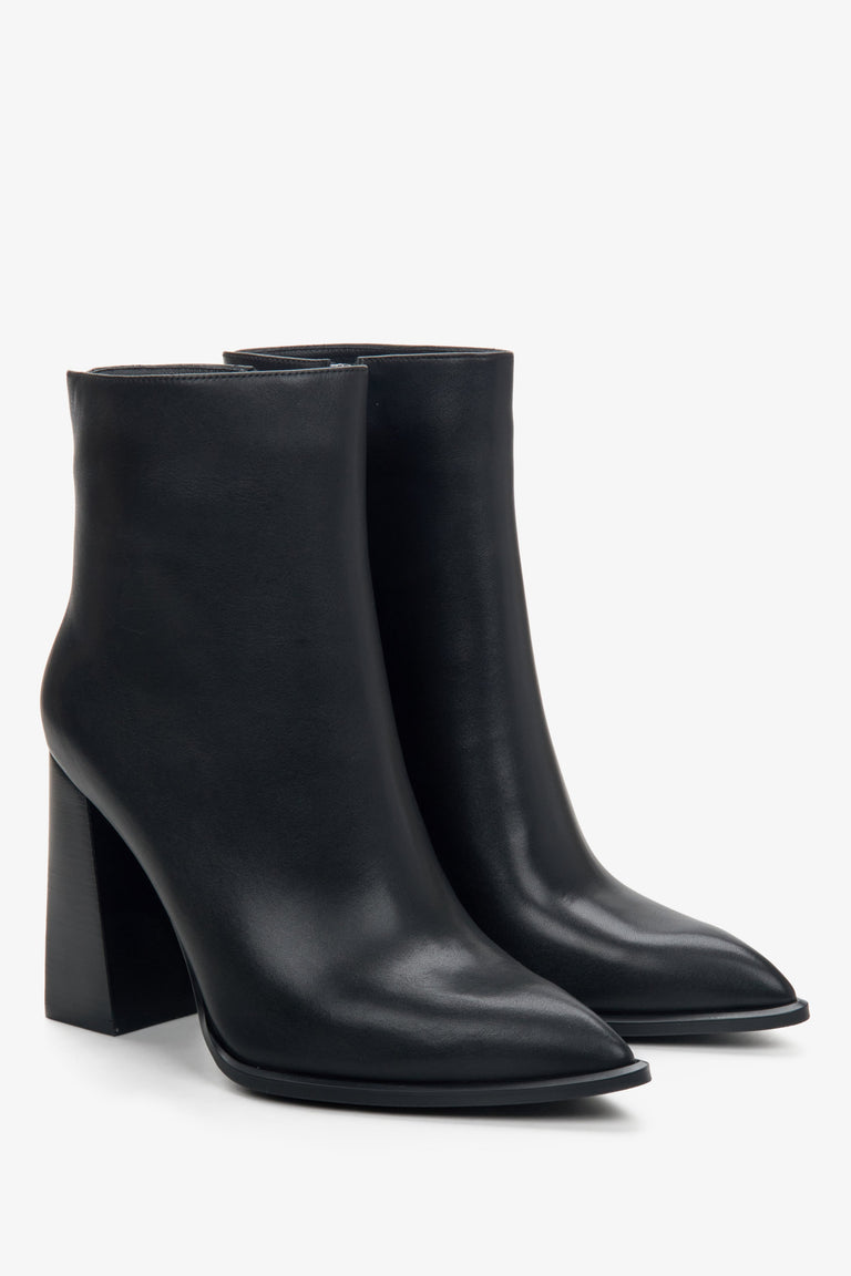 Women's black leather ankle boots with a block heel.