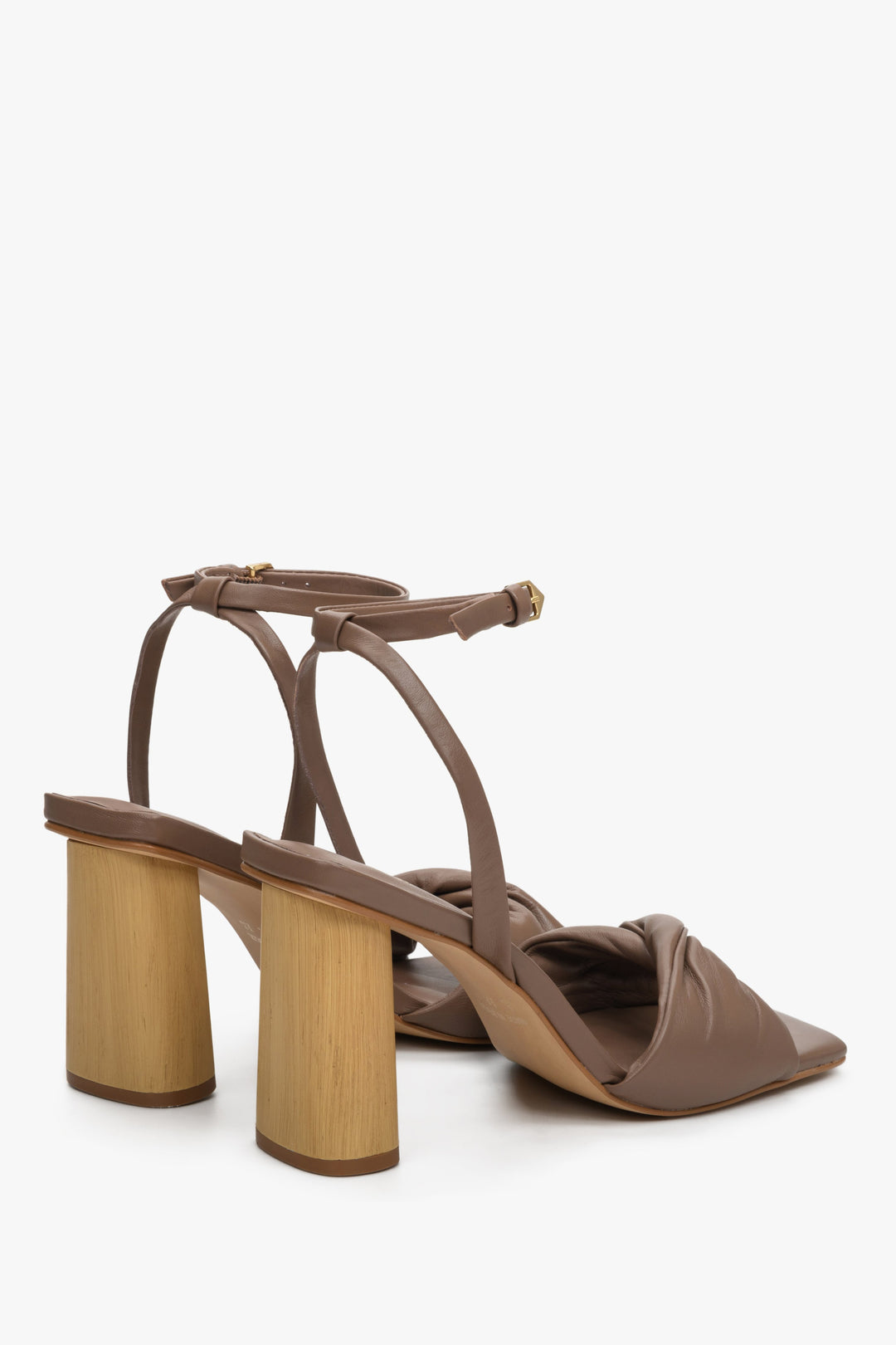 Women's brown leather sandals with a block heel - close-up on the heel.