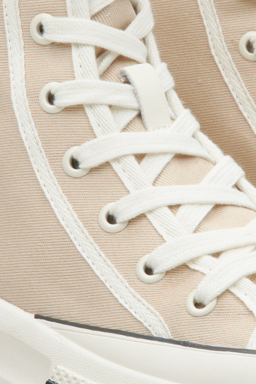 High-top athletic women's sneakers by Estro in beige - close-up on details.