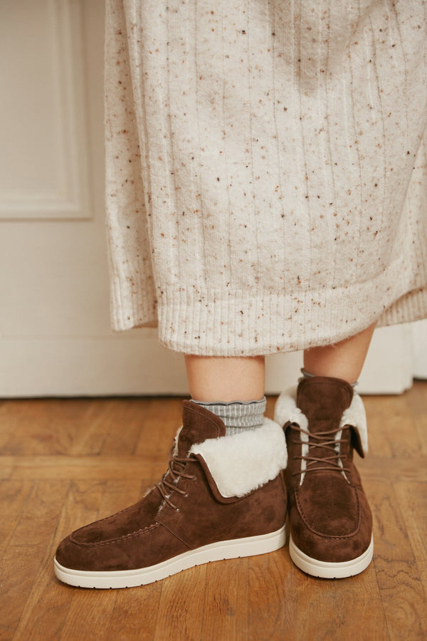 Winter women's brown velour boots by Estro - presentation on a model.