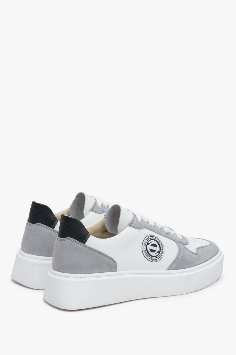 Leather, gray-and-white women's sneakers with laces by Estro - close-up on the heel and side seam.