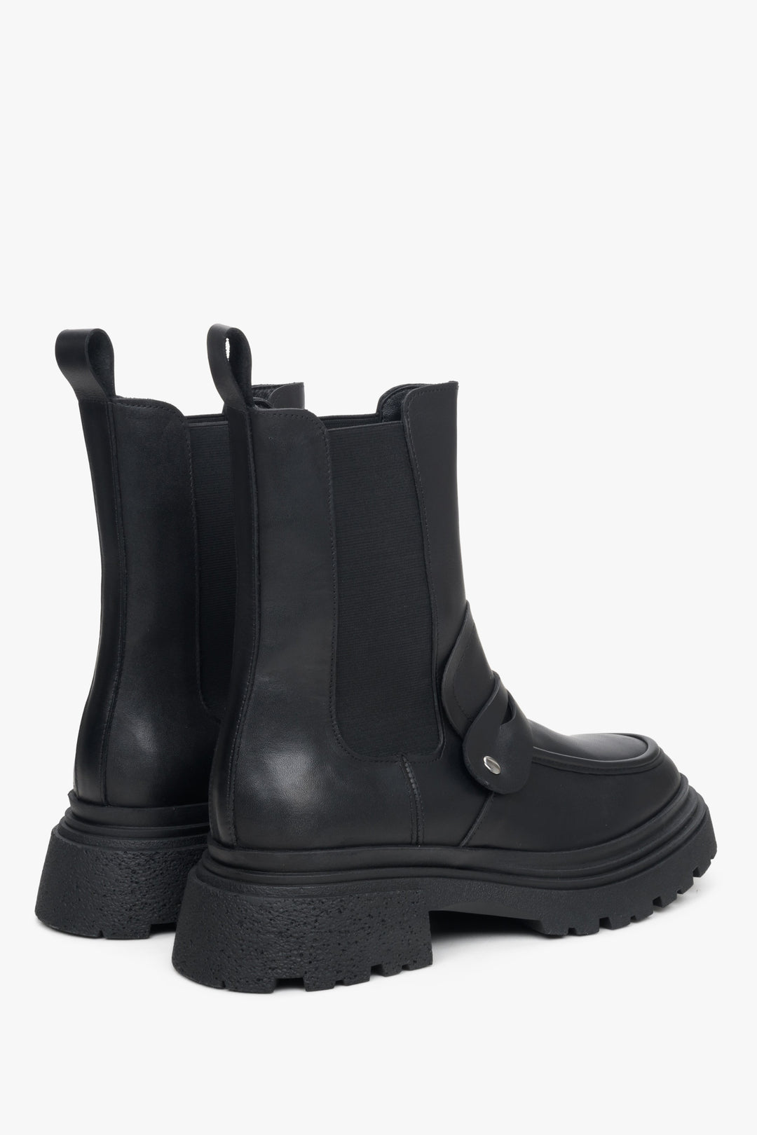 Women's black leather Chelsea boots with ornament by Estro - close-up on the heel and side line.