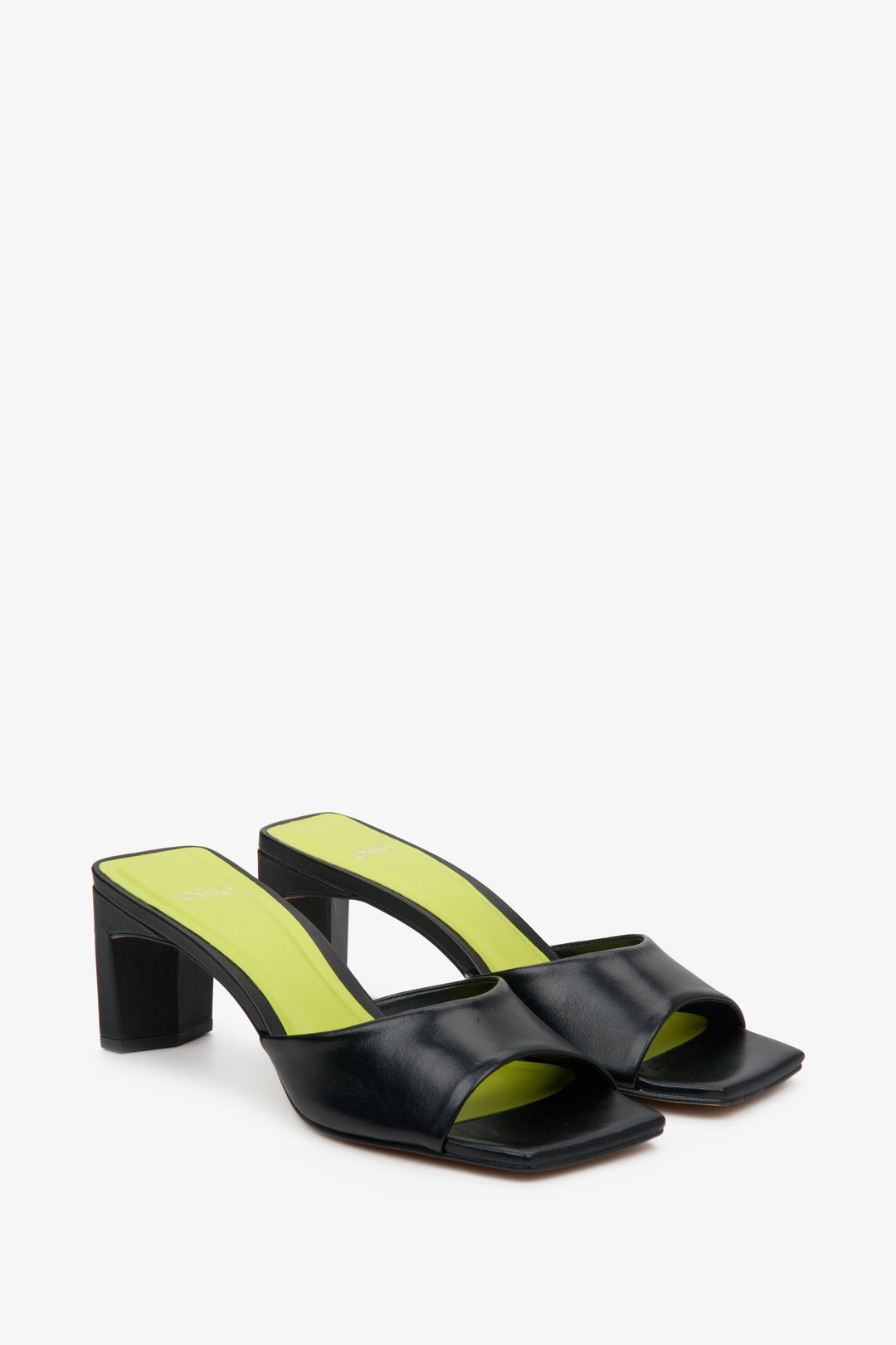 Women's black leather mules with a sturdy block heel by Estro - close-up on the shoe's toe.