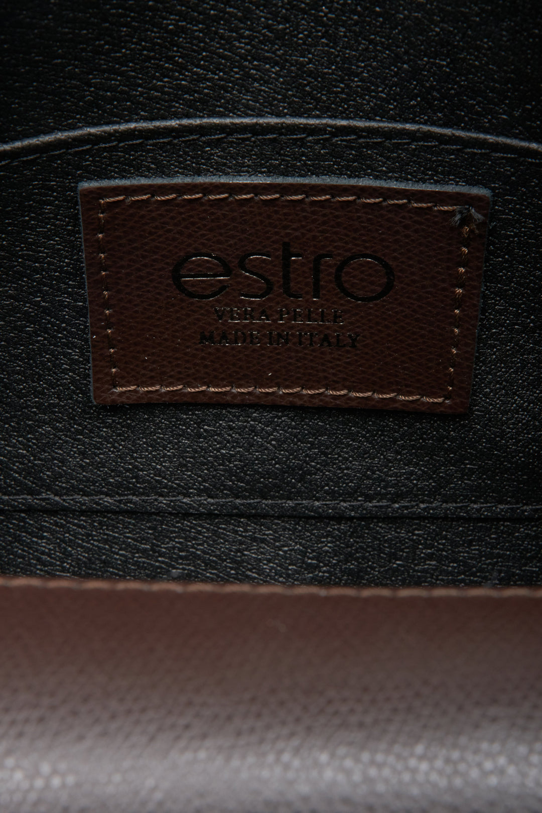 Women's dark brown leather handbag by Estro - close-up on details.