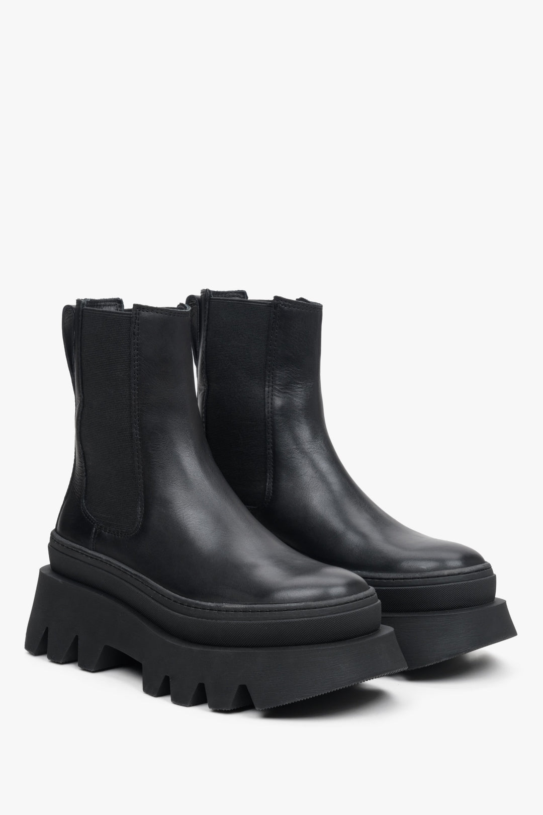 Women's black leather chelsea boots on a platform by Estro - close-up on the toe and side seam of the shoes.