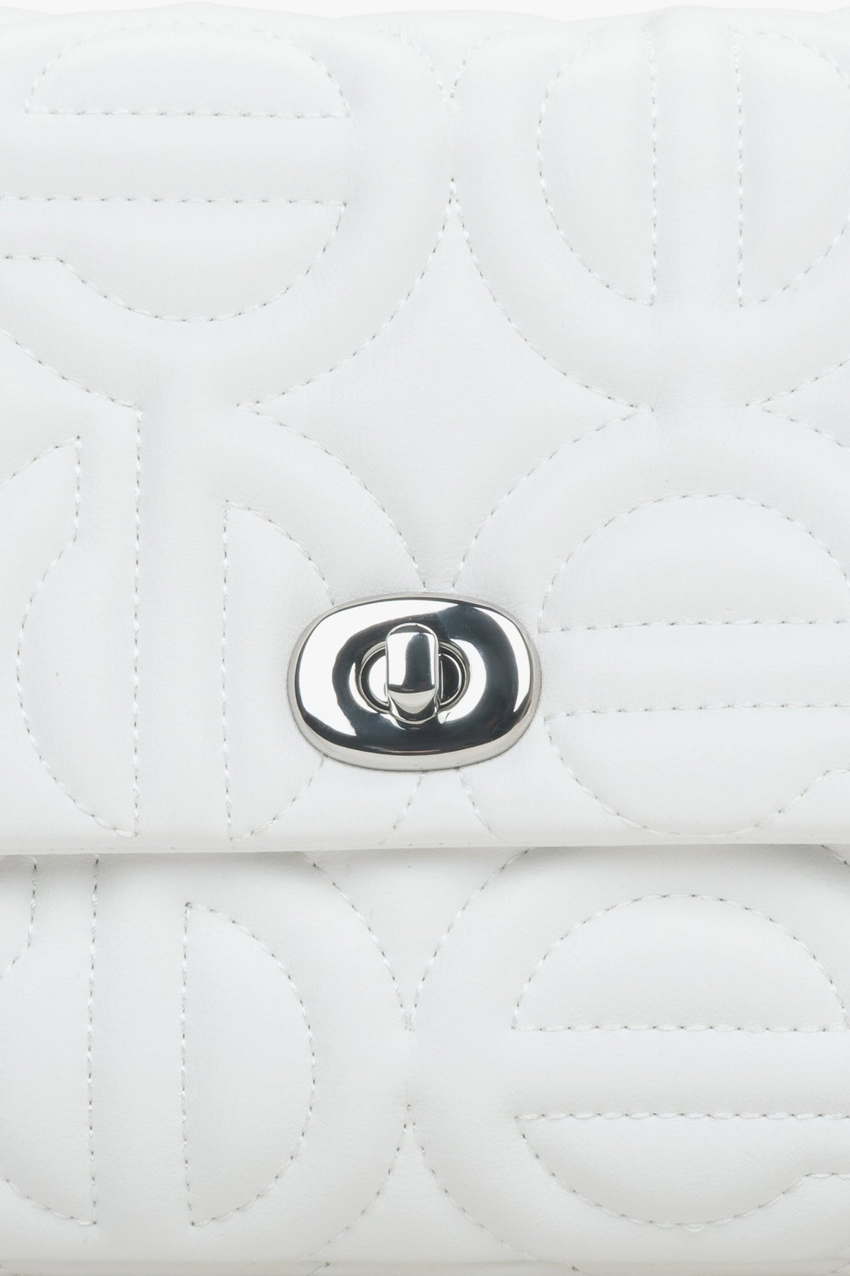 Women's small white  shoulder bag with a silver chain - details.
