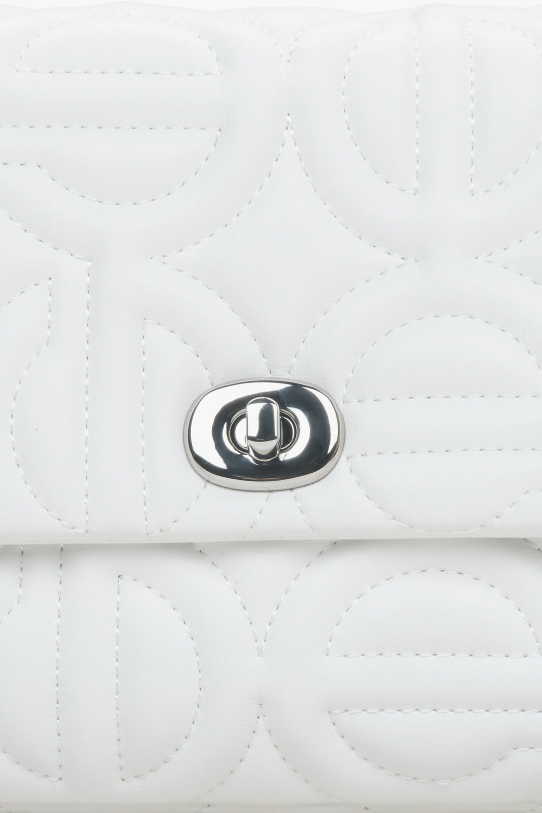 Women's small white  shoulder bag with a silver chain - details.