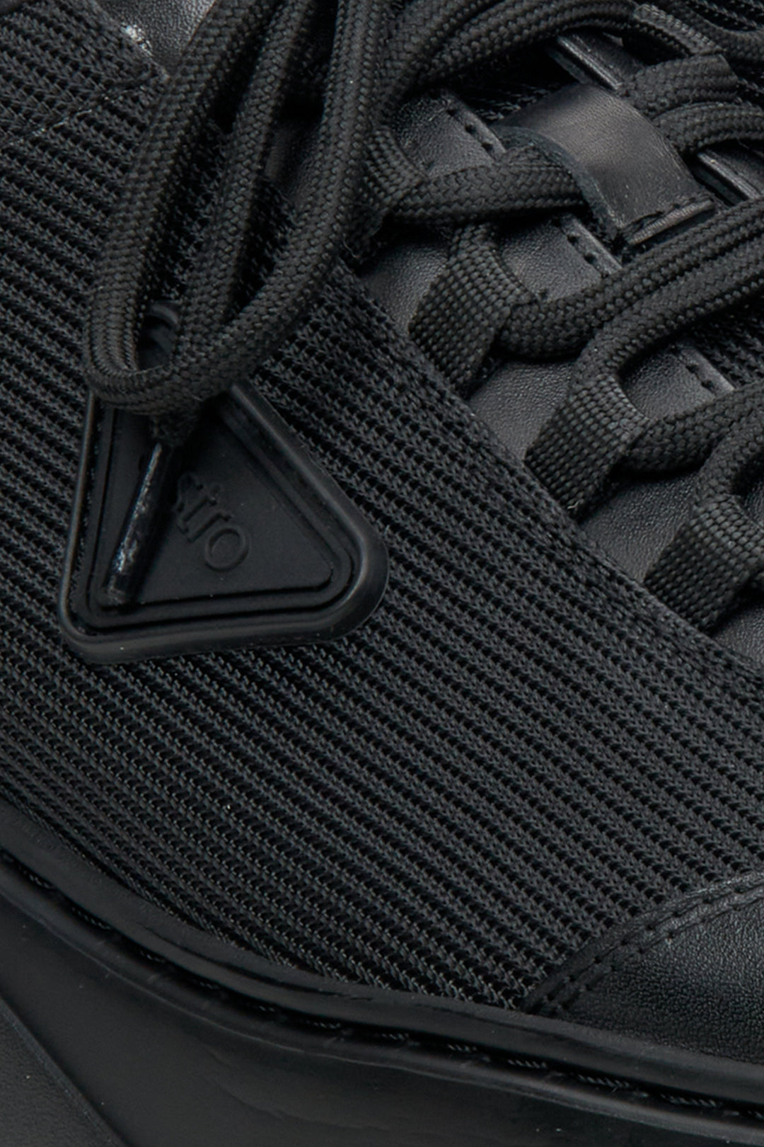 Men's black dress shoes by Estro made of mixed materials - close-up on the detail.