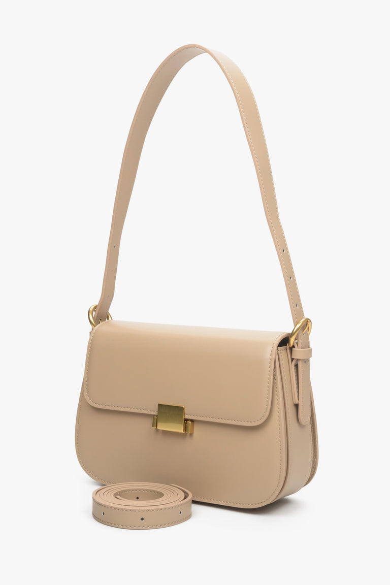 Women's beige handbag made of genuine leather with gold accents by Estro.