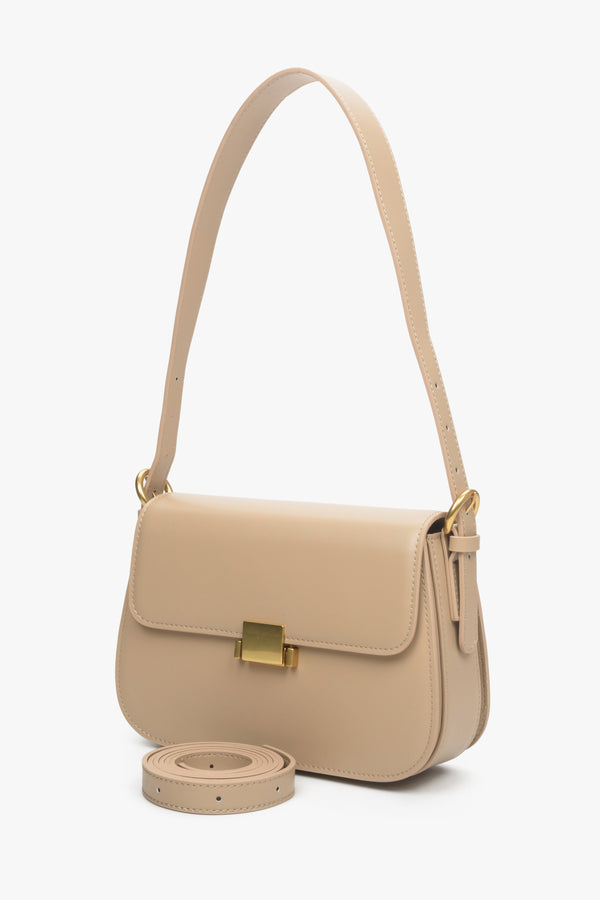 Women's beige handbag made of genuine leather with gold accents by Estro.