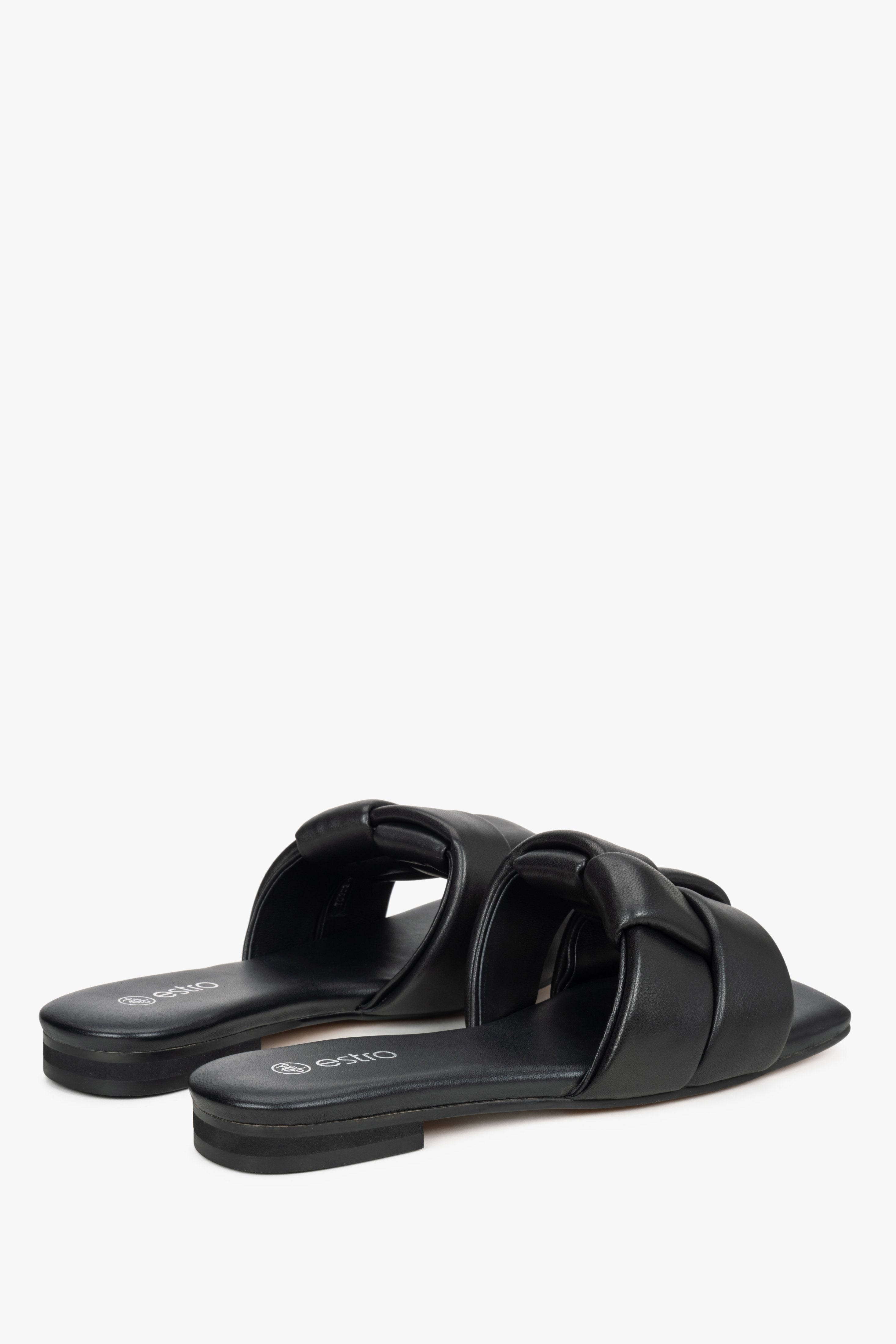 Women's black leather slides by Estro with a flat heel.