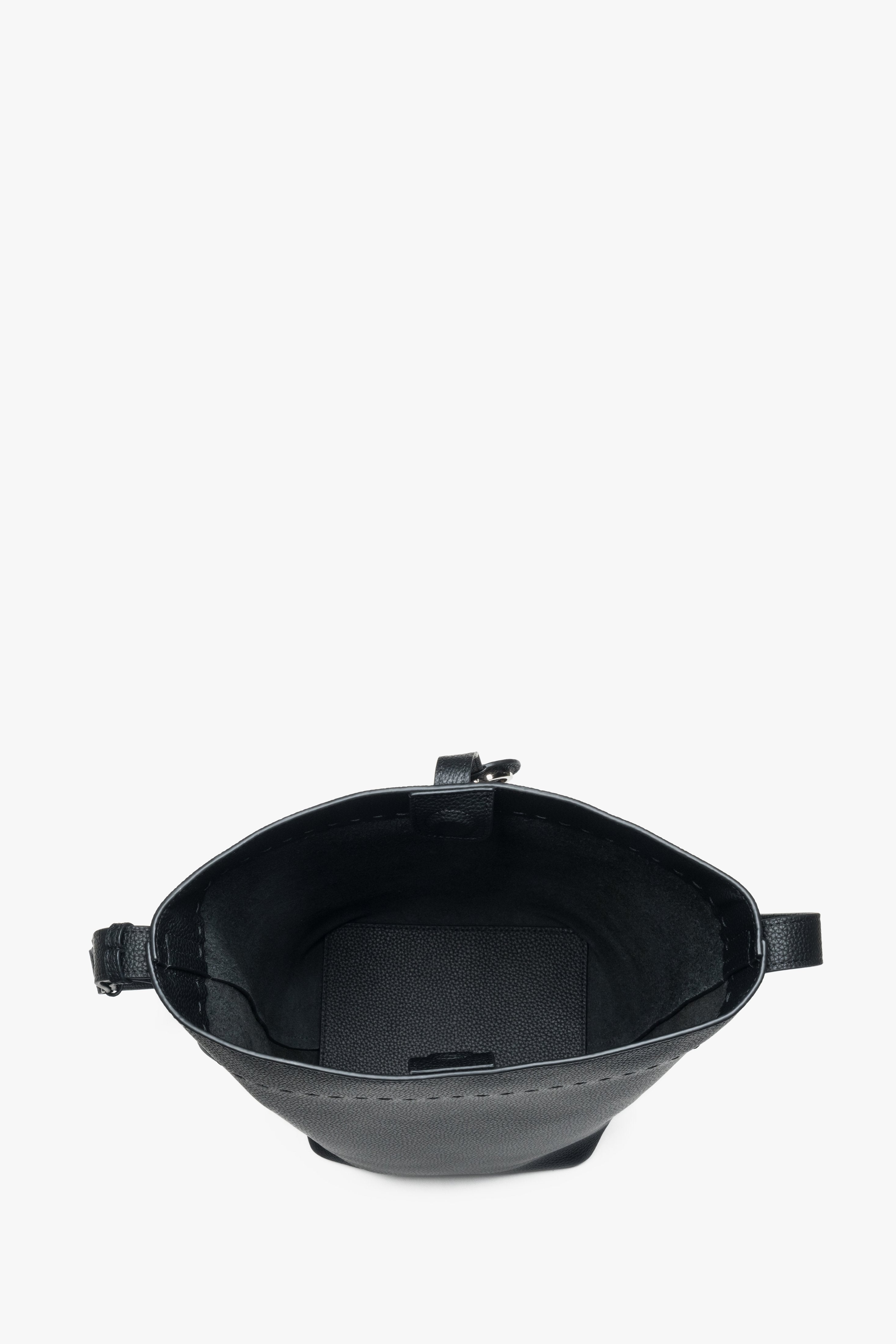 Black bucket bag for women, featuring a genuine leather construction and a strap.