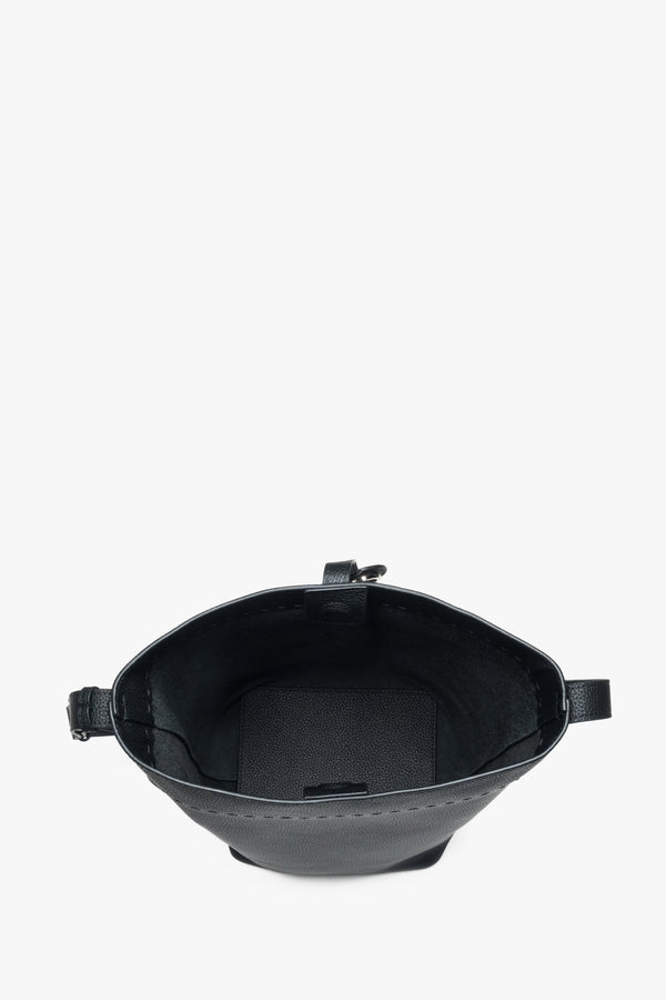 Black bucket bag for women, featuring a genuine leather construction and a strap.