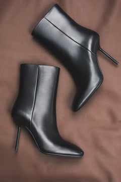 Black stiletto ankle boots for women, crafted from genuine natural leather.