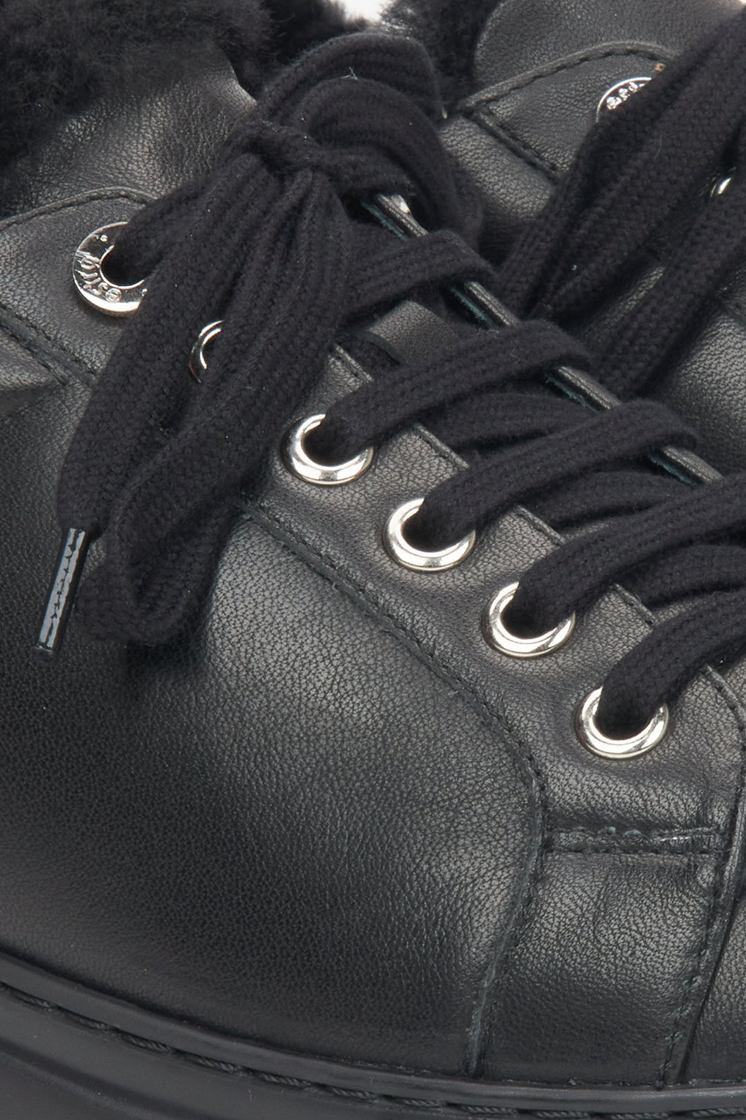 Premium Black Women's Low-Top Winter Sneakers with Warm Fur Lining by Estro - a close-up on lacing.