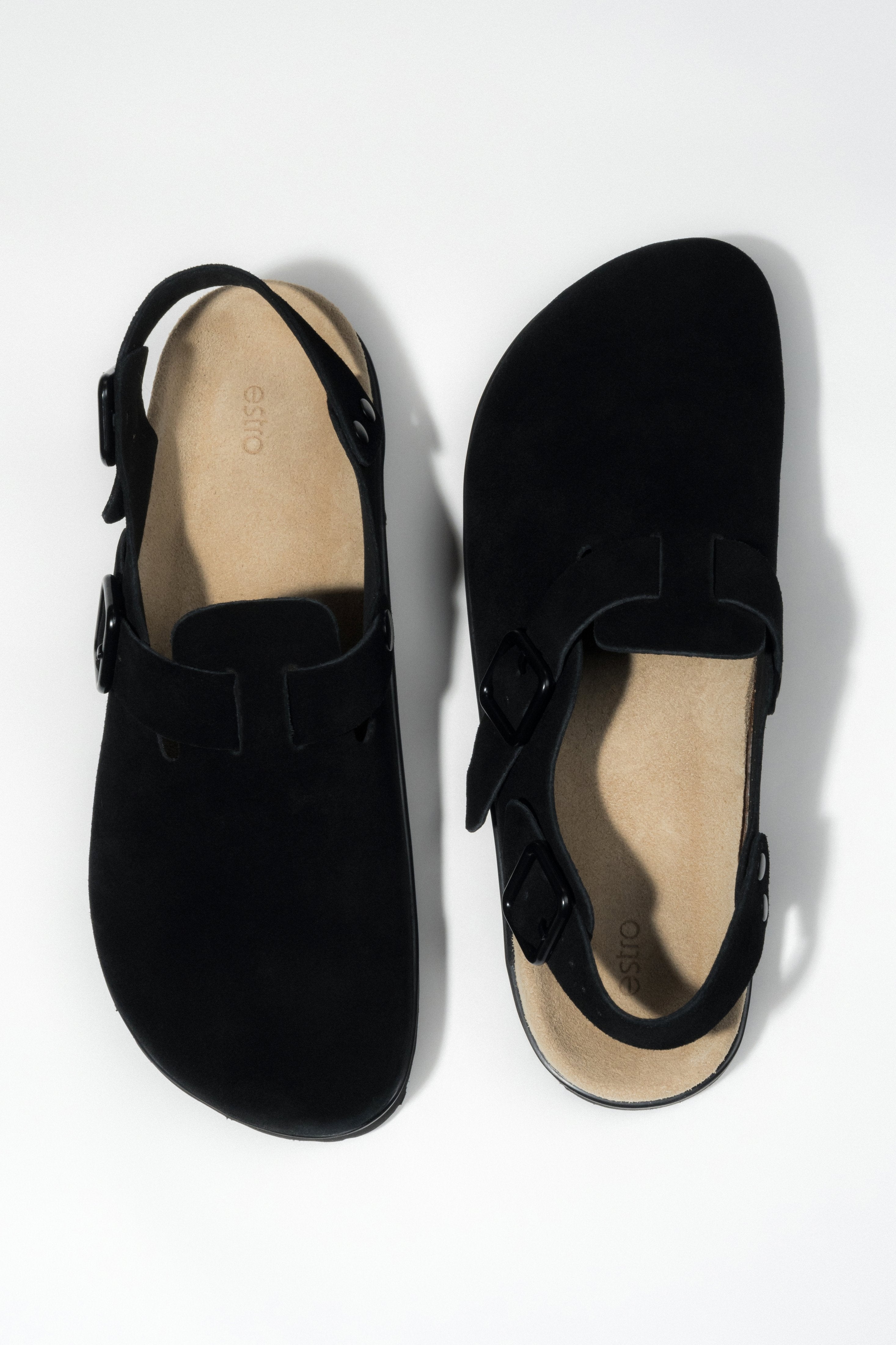 Women's black closed-toe clog sandals made of genuine suede.
