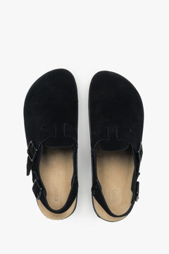 A pair of women's classic black clogs with a covered toe, made from soft genuine suede.