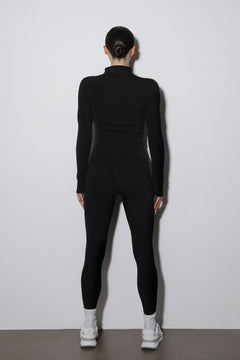 Back of black tracksuit sweatshirt and pants.