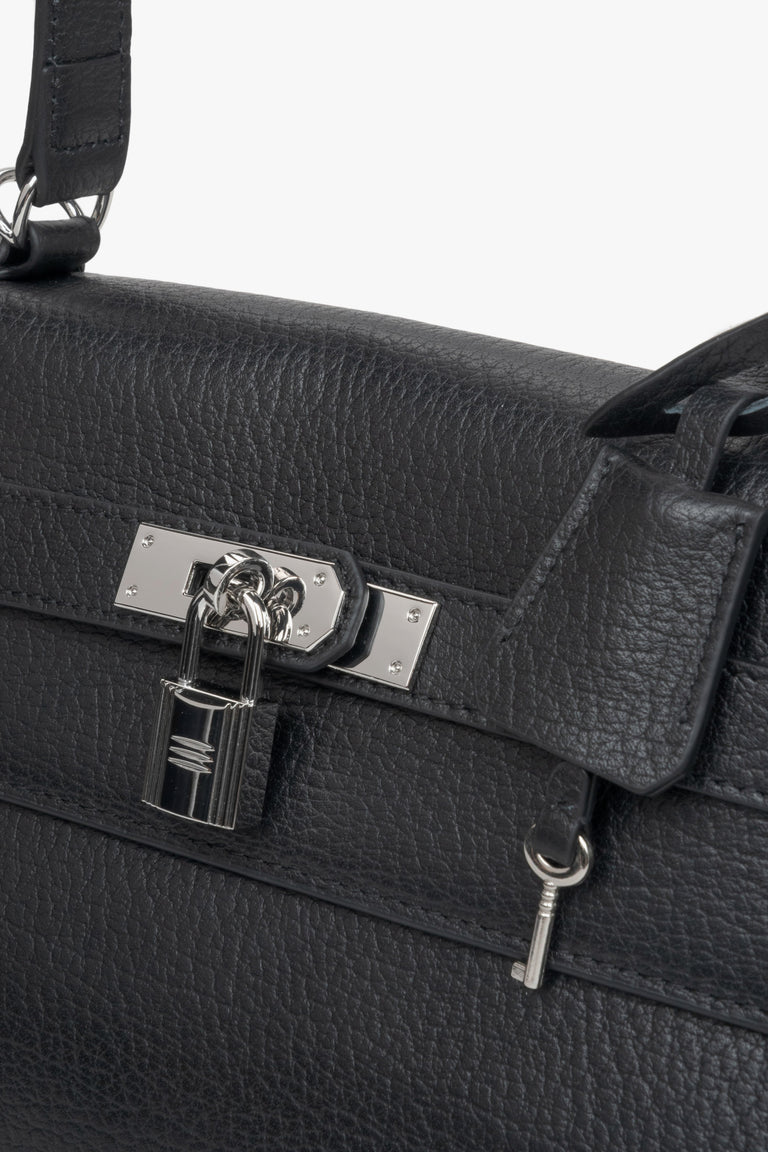 Black women’s shoulder bag from Estro, adorned with silver-tone hardware for understated elegance- details.