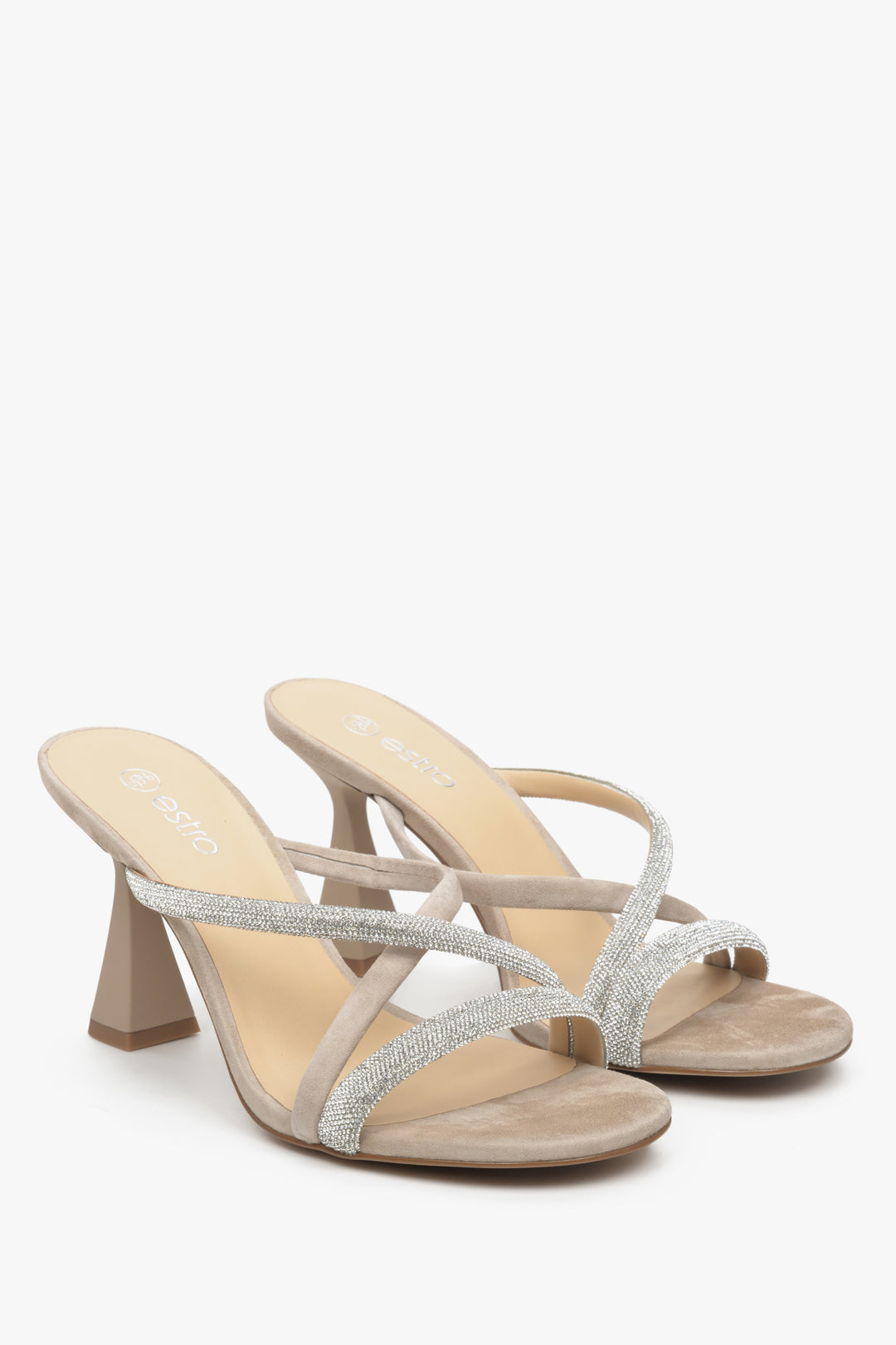 Women's beige stiletto heeled sandals.