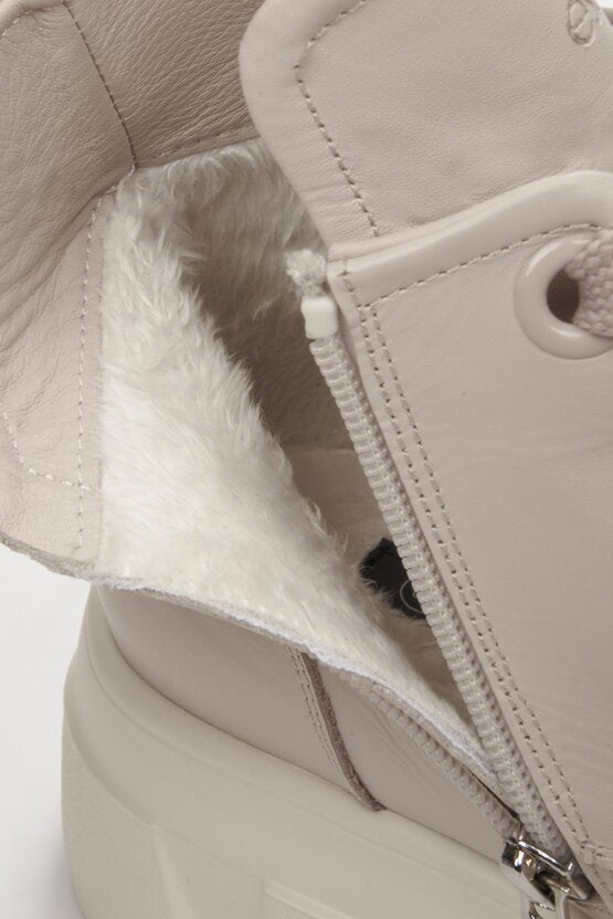 Women's grey ankle boots made of genuine leather - close-up on details.