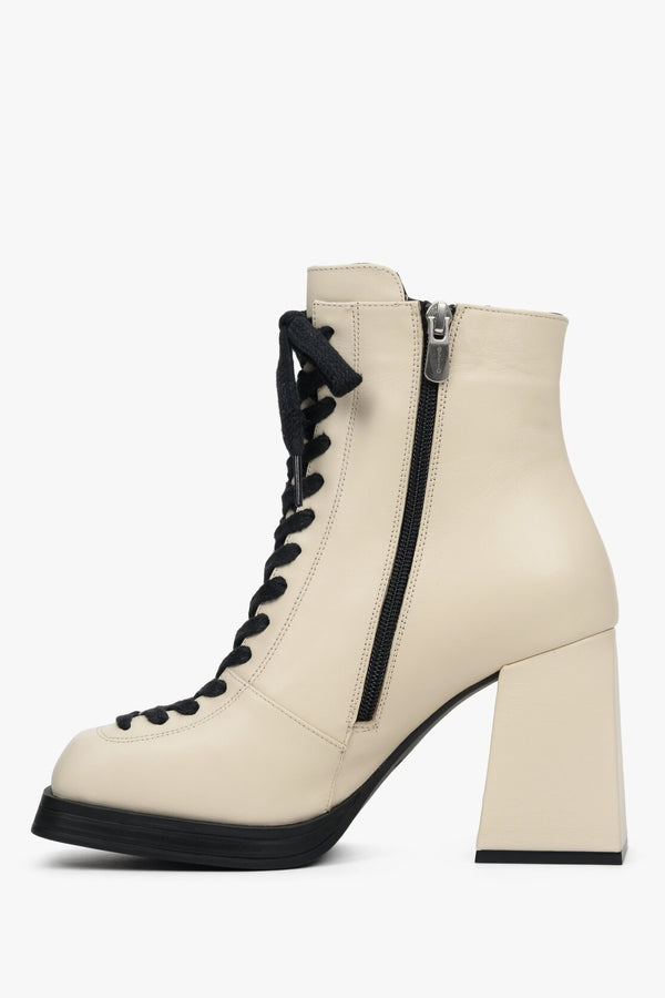 Women's beige ankle boots with a heel made of genuine leather - shoe profile.