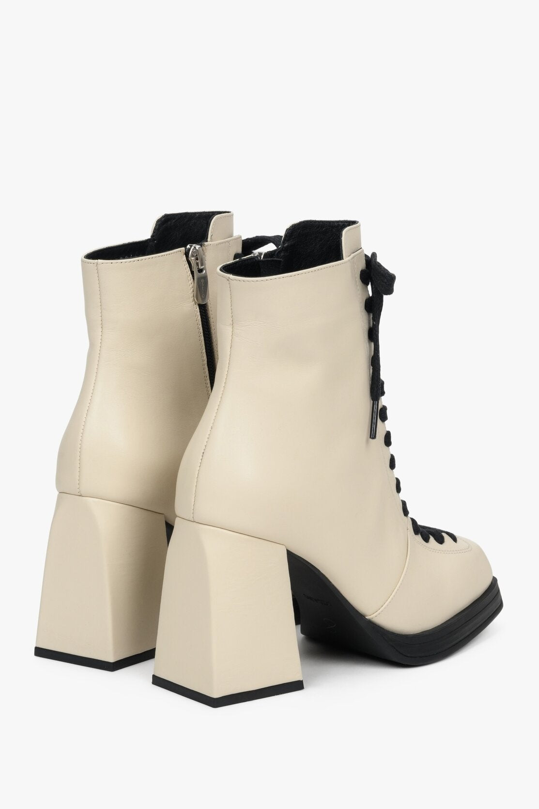 Women's beige high-heeled ankle boots made of genuine leather.