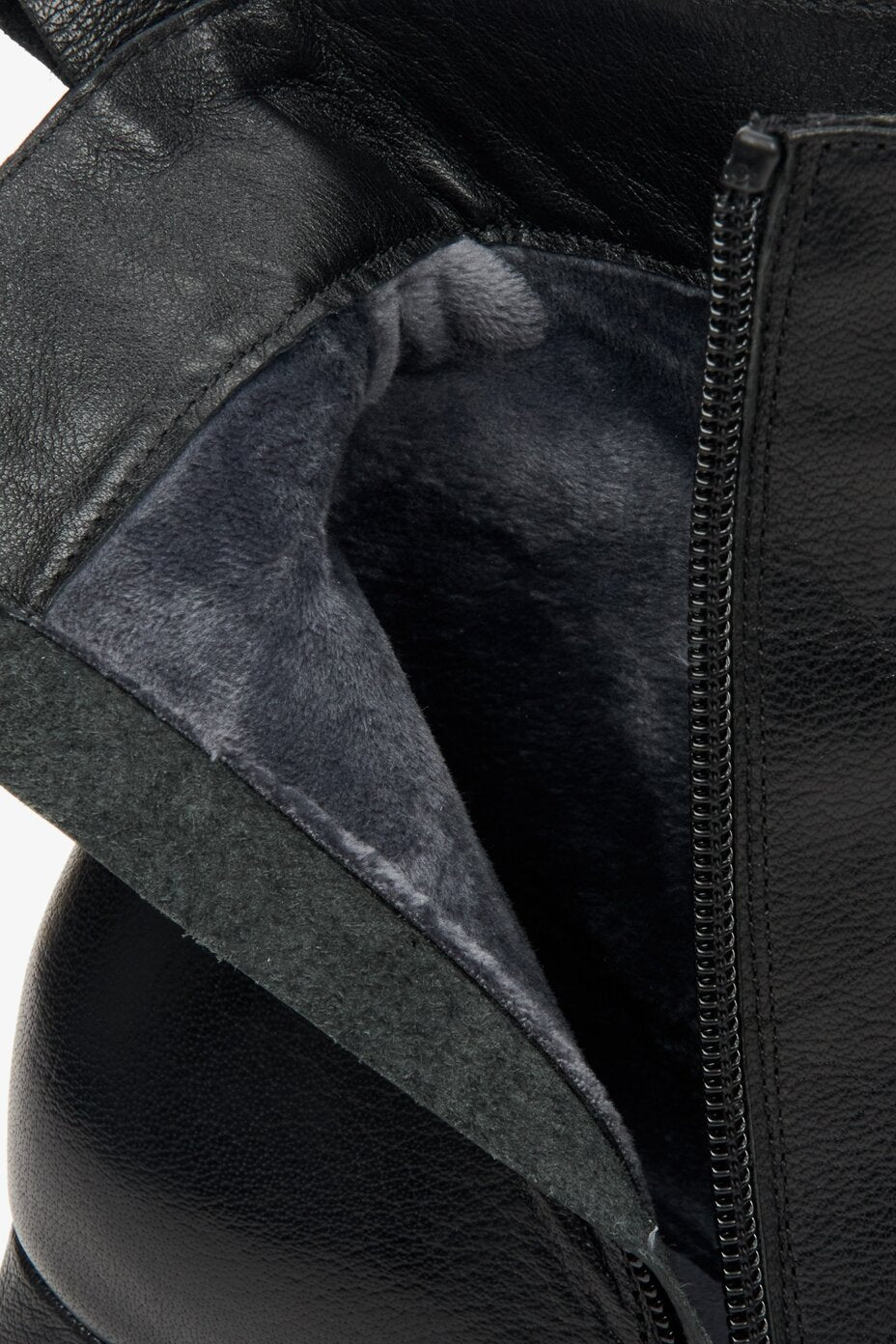 Women's leather black boots - close-up on details.