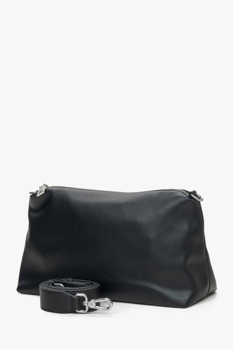 Estro women's black leather crossbody bag with a chain.