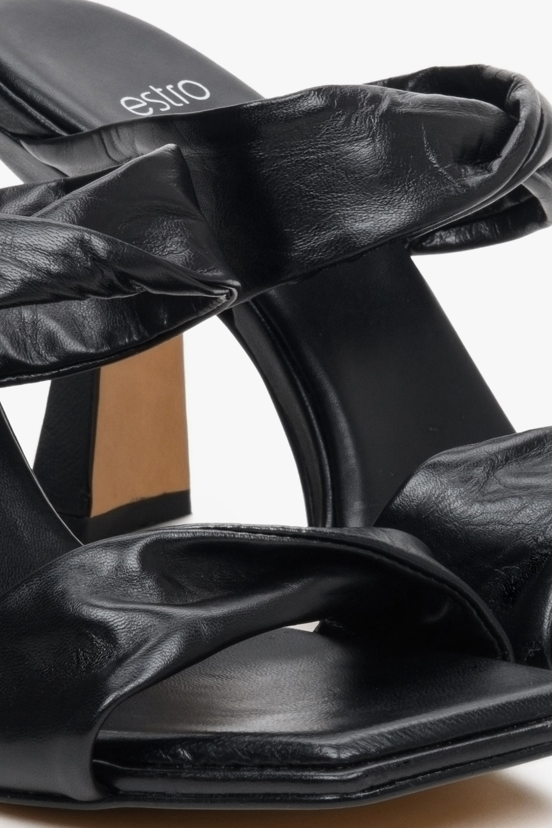 Women's black leather heeled sandals by Estro - close-up on details.