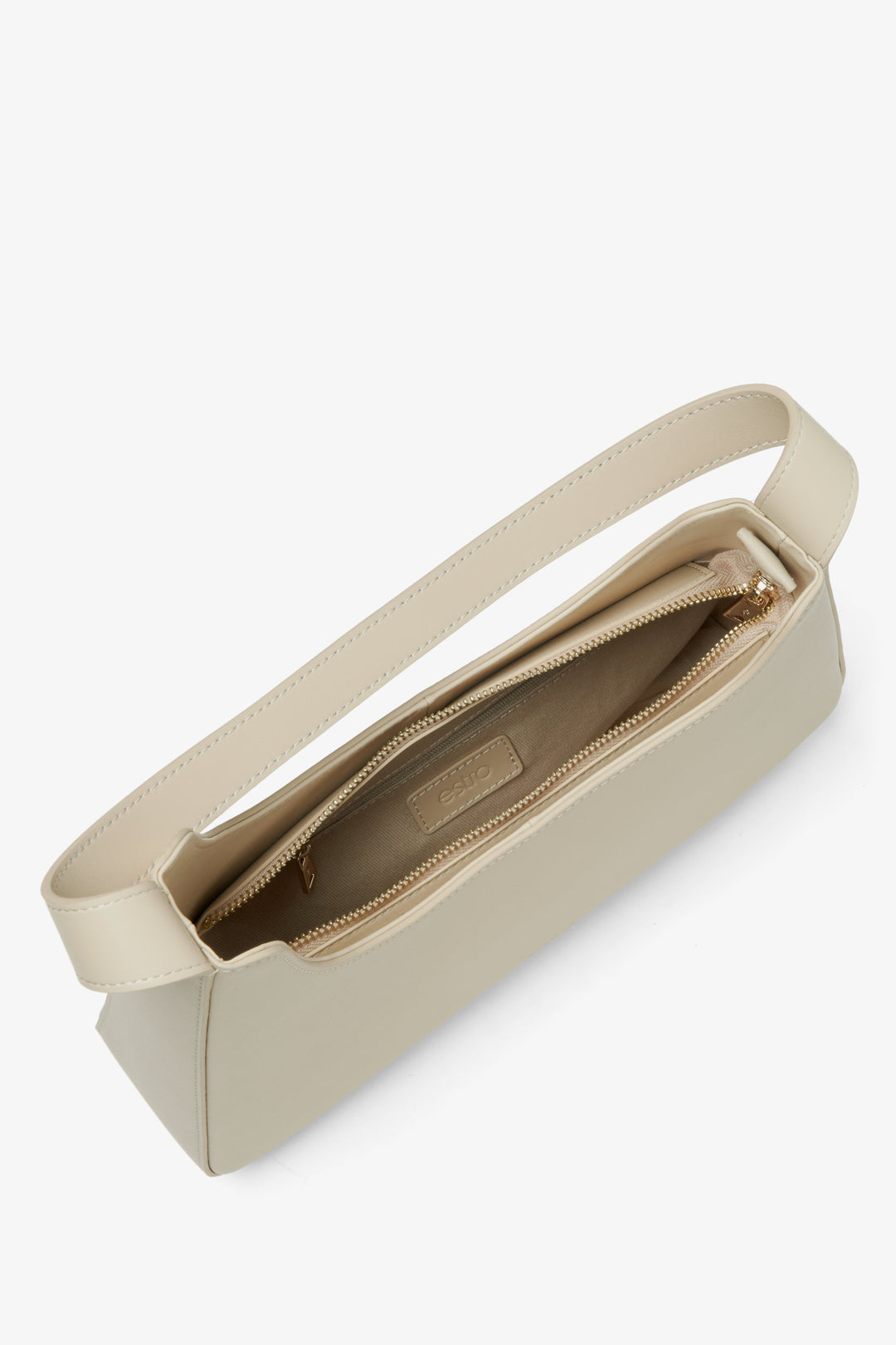 Light beige leather handbag Estro - a close-up on bag's compartment.