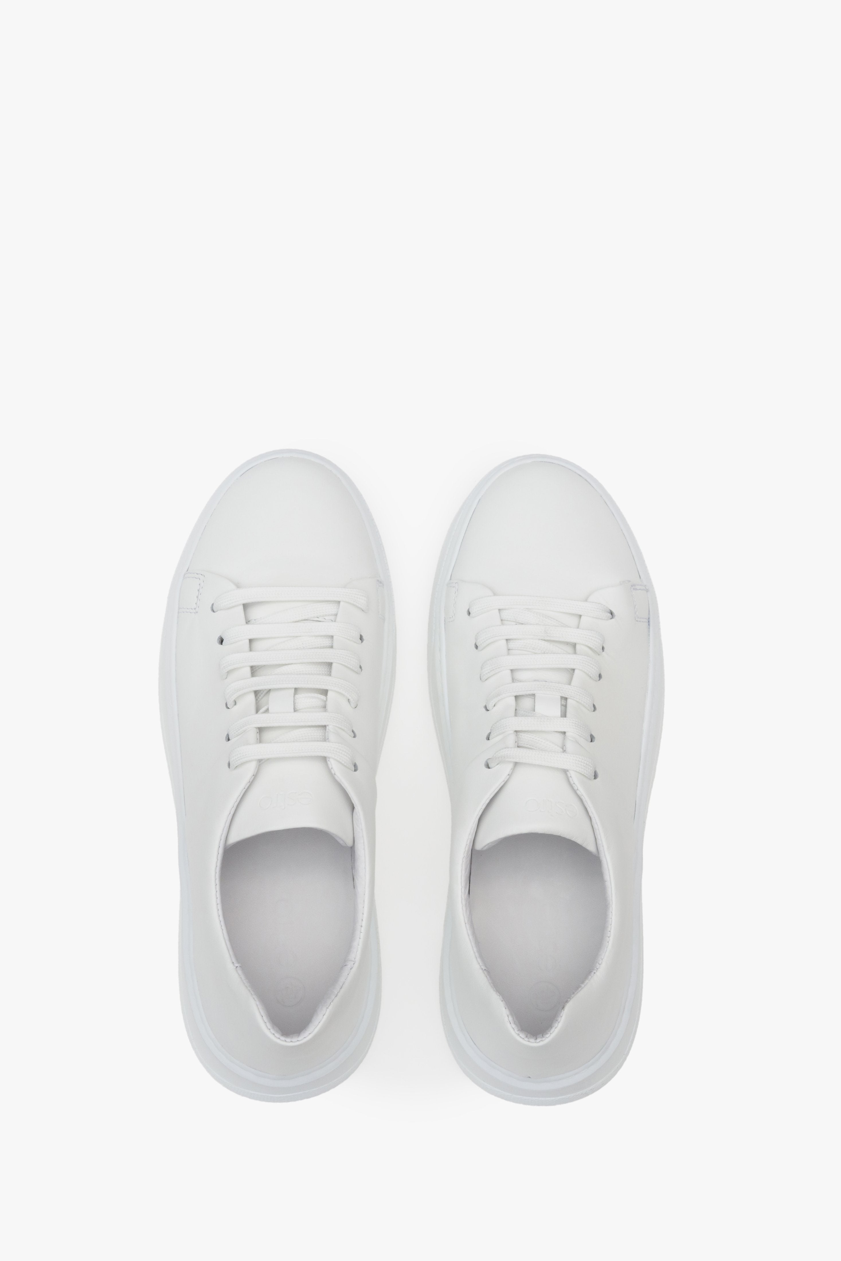 Women's white sneakers made of genuine leather by Estro - top view presentation of the model.