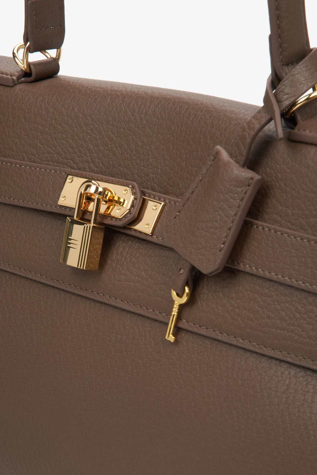 Elegant brown leather shoulder bag for women with gold-tone hardware, designed by Estro - details.