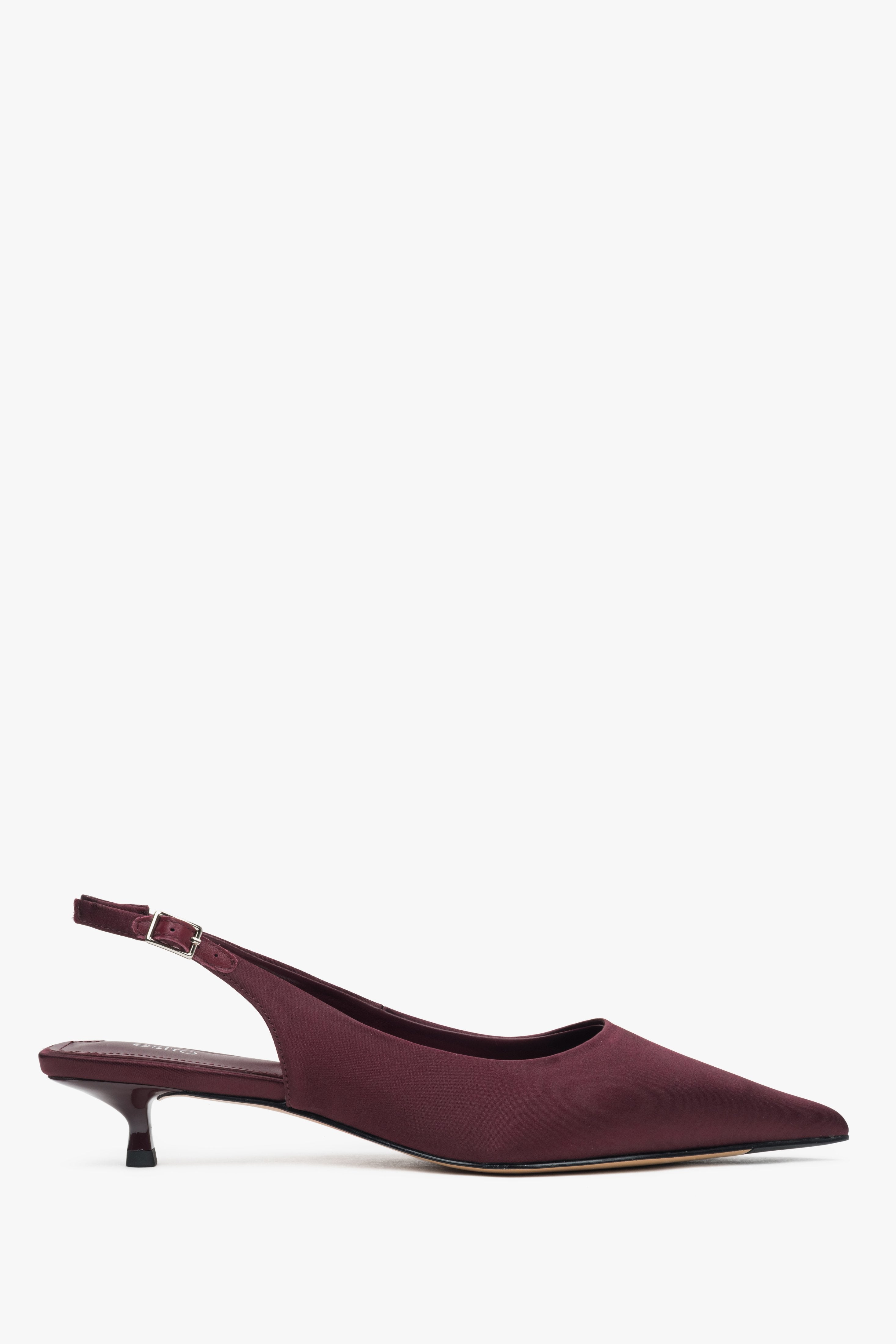 Burgundy women's slingback pumps with a low heel and open back.