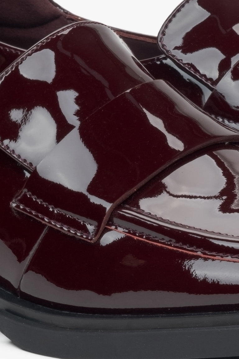 Women's burgundy patent leather loafers by Estro - close-up on details.