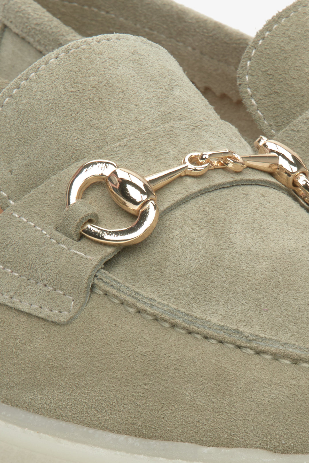 Estro light green women's loafers with gold buckle - close up on details.